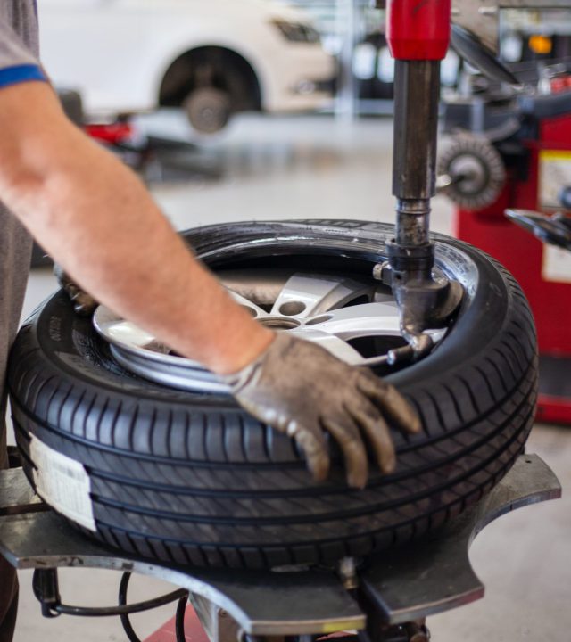 Mecanic working on a tire